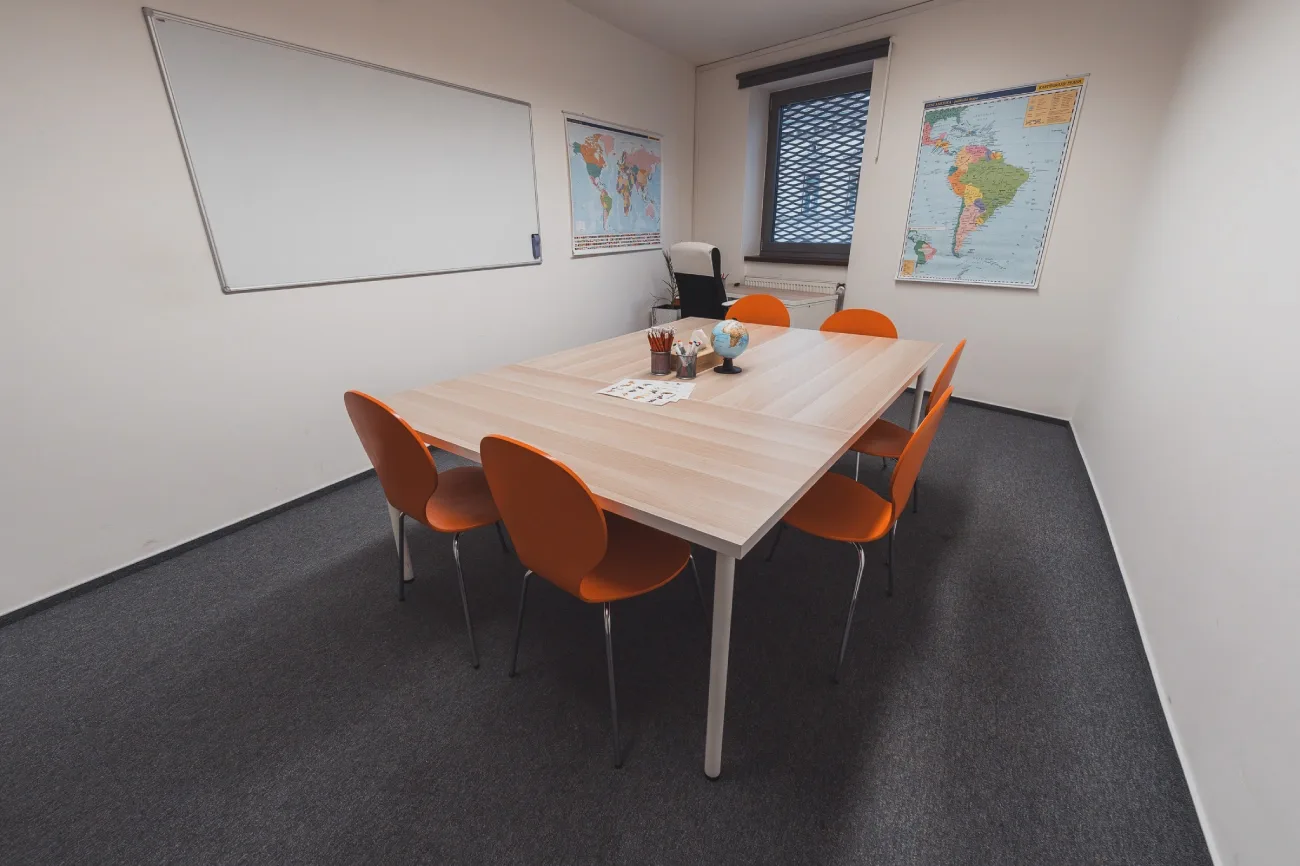 A classroom for group Spanish lessons with a map of Spain, study materials and comfortable beanbags